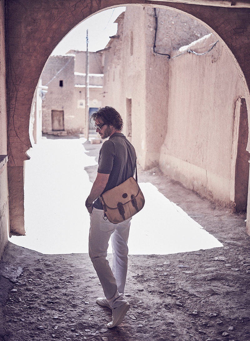 Donny wears pants Baldessarini, shirt Cividini, sneakers Superga, bag Mulberry, and glasses Cutler & Gross.