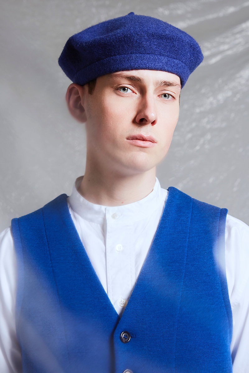 Hubert wears beret ASOS, vest and shirt Omen.