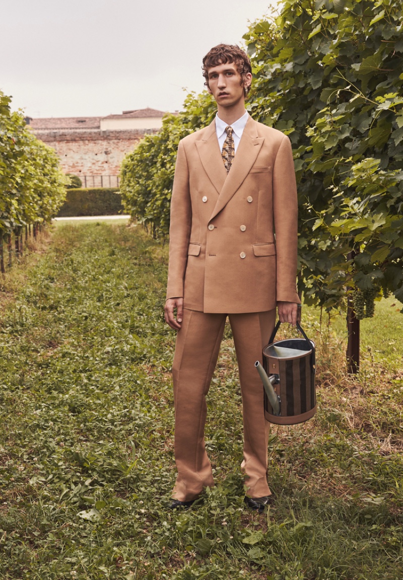 Donning a tan double-breasted suit, Etienne de Testa stars in Fendi's spring-summer 2020 campaign.