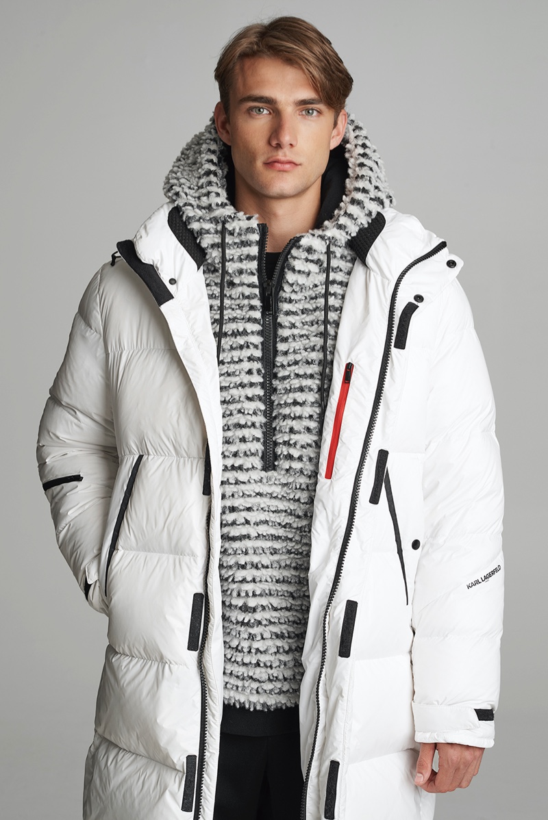 Model Matthew Pollock wears a sherpa anorak with a white down coat from Karl Lagerfeld's après-ski capsule collection.
