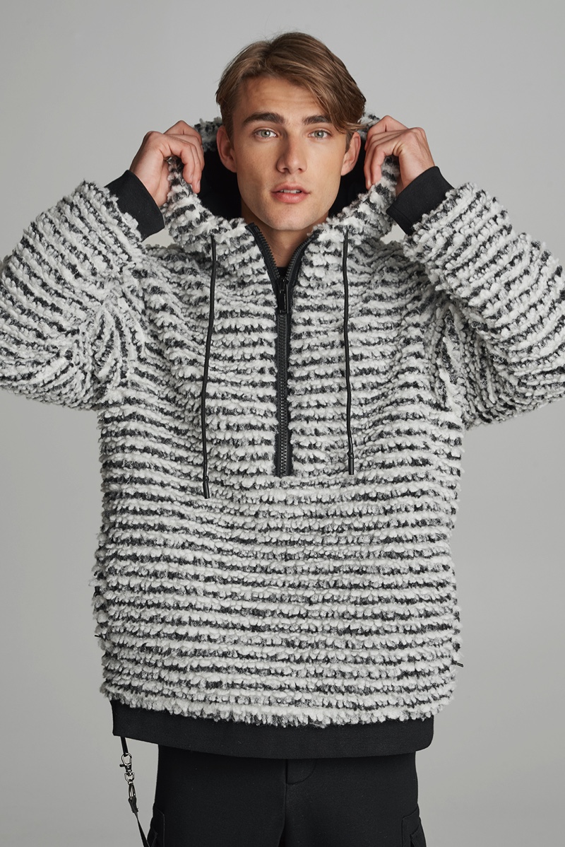 Matthew Pollock sports a sherpa anorak from Karl Lagerfeld's après-ski capsule collection.