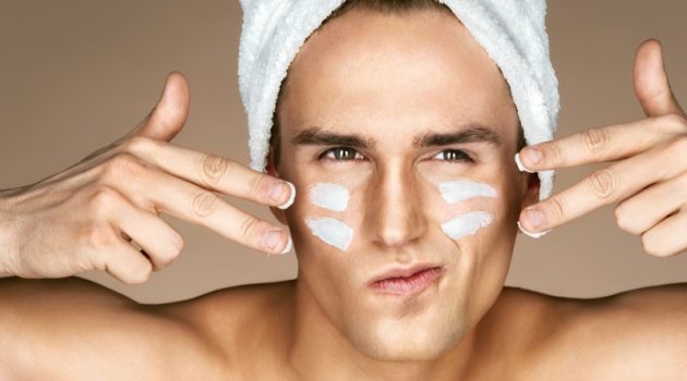 Ways Dermatologists Wake Up With Younger-Looking Skin Male Model Closeup Moisturizing Face Skincare