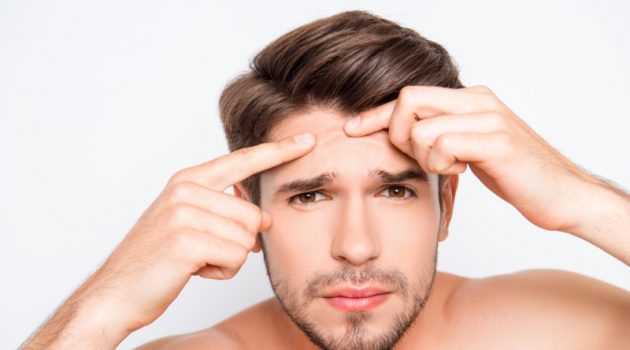 How To Deal With Acne When You Are a Man? Man Checking Face Breakout Acne
