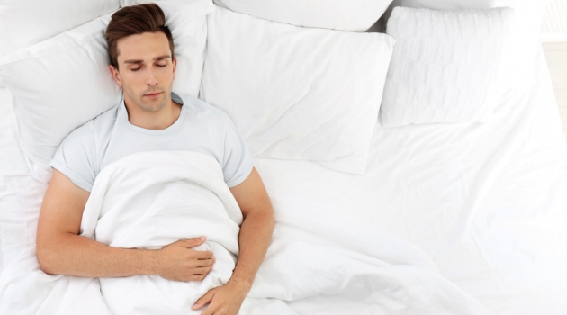 Five Tips for Picking the Perfect Bed for You Man Sleeping in Bed
