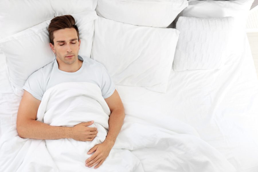 Man Sleeping in Bed