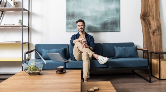 Choosing Living Room Furniture to Create Your Ideal Ambiance Man in Stylish Living Room