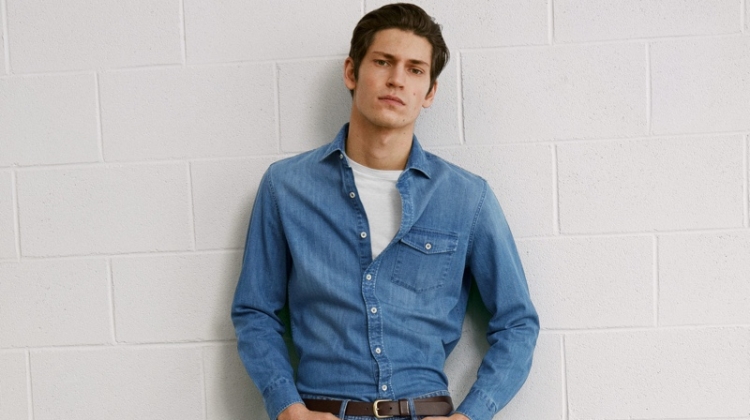 Rocking a denim shirt and jeans, Justin Eric Martin wears a double denim look from Mango.