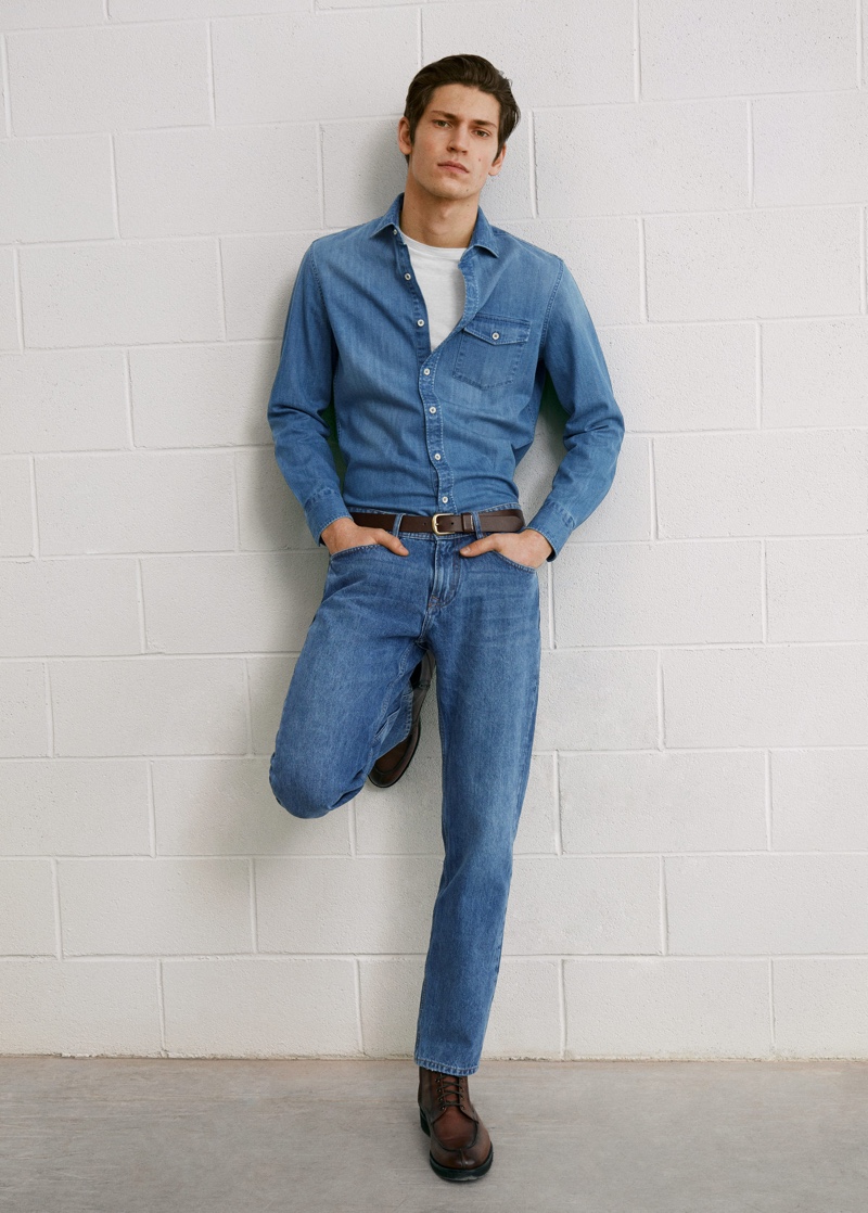 Rocking a denim shirt and jeans, Justin Eric Martin wears a double denim look from Mango.