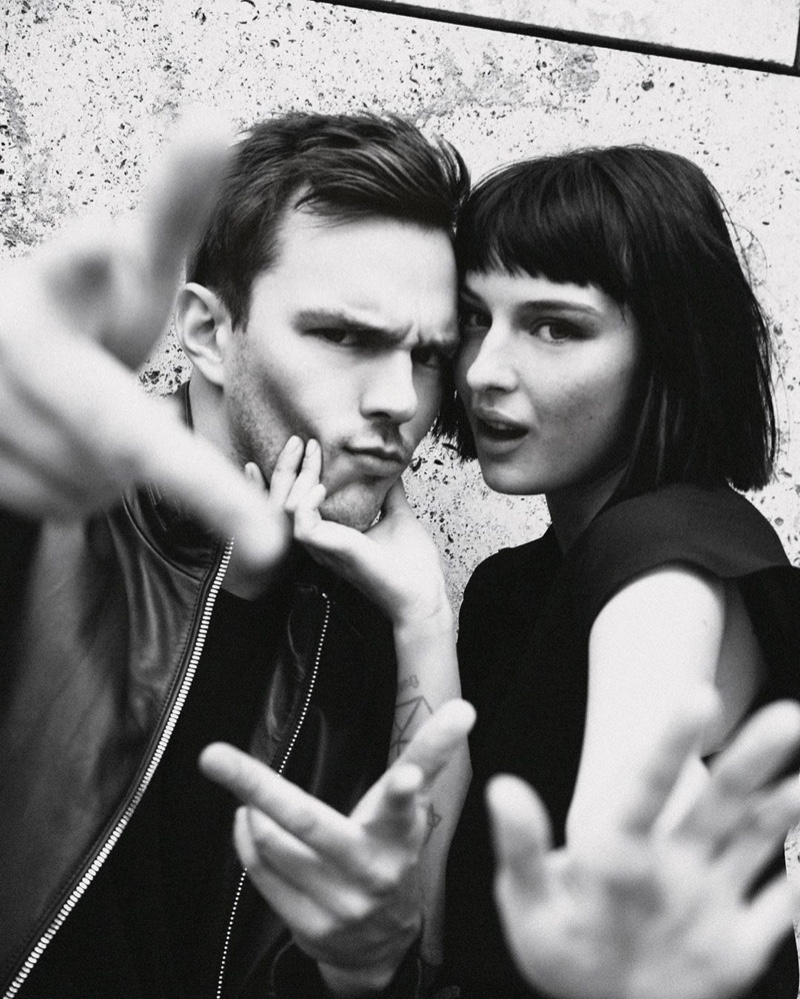 Nicholas Hoult and Alice Pagani pose for a behind the scenes image by photographer Damon Baker.