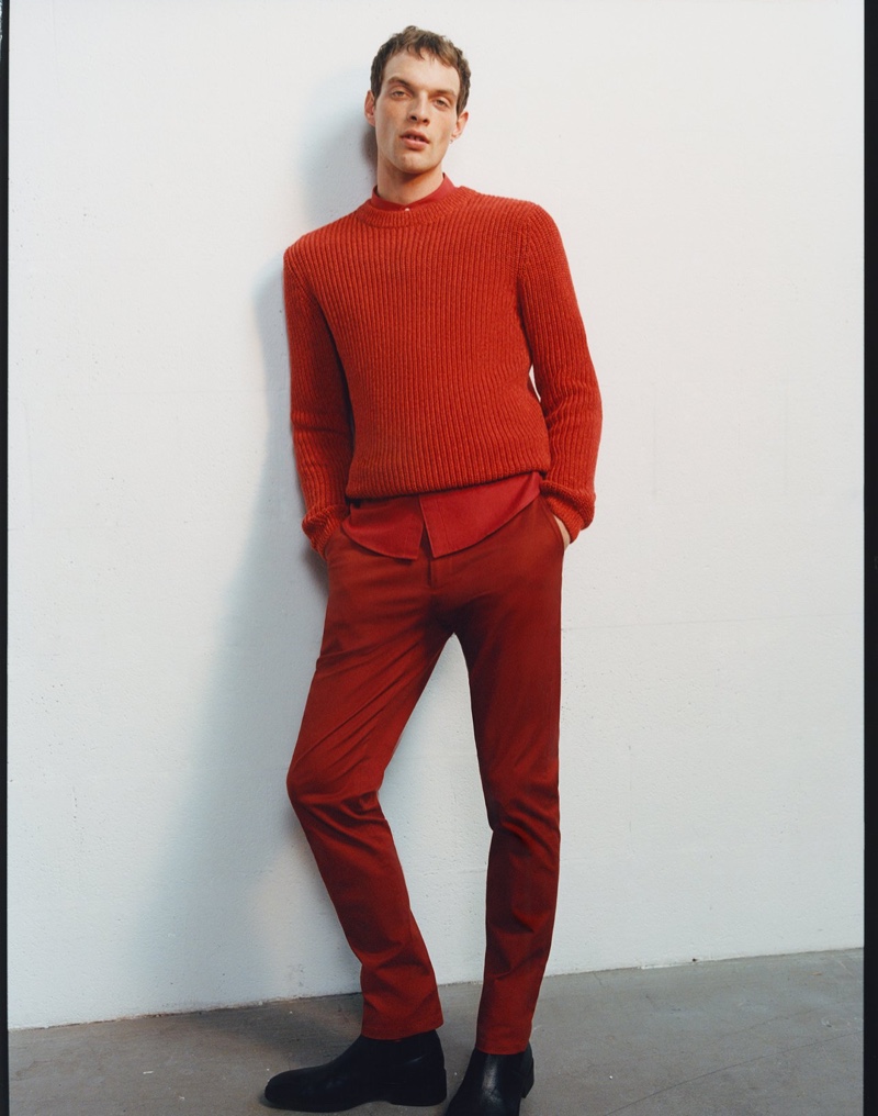 Making a statement in red, Rocky Harwood wears Reserved.