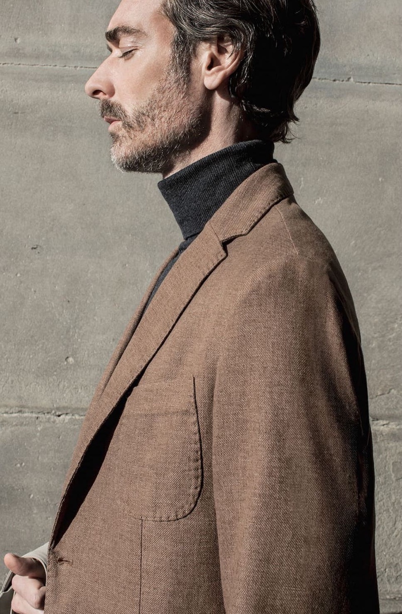 Delivering a side profile, Richard Biedul goes sartorial in a look from Massimo Dutti.