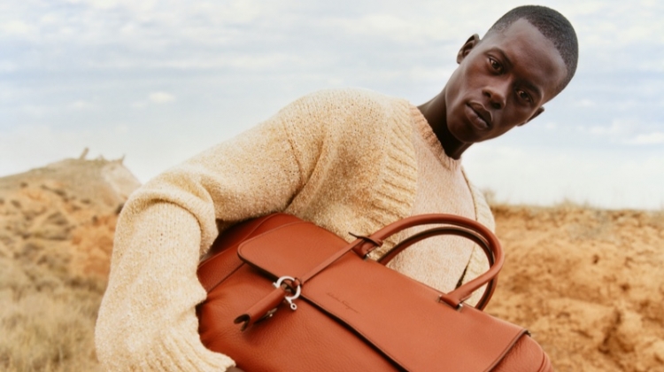 A vision in creamy hues, Alpha Dia stars in Salvatore Ferragamo's spring-summer 2020 men's campaign.