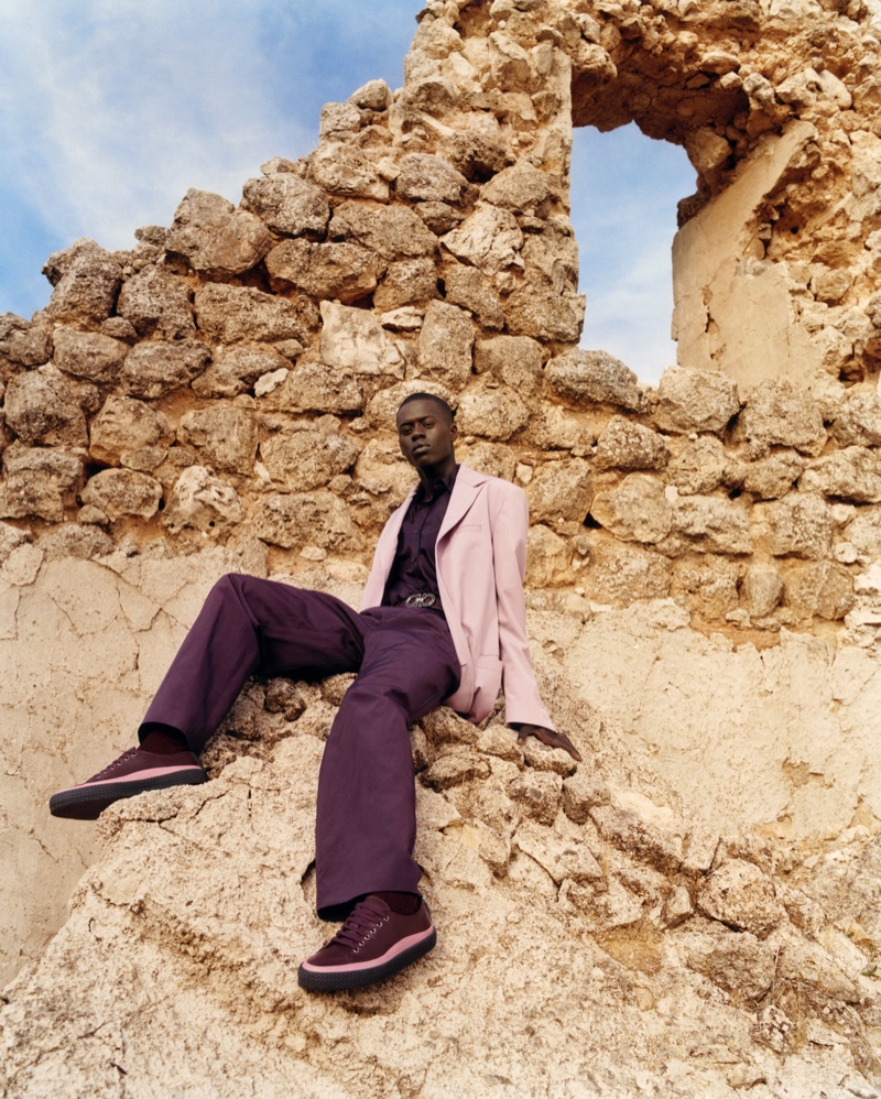 Embracing shades of purple, Alpha Dia stars in Salvatore Ferragamo's spring-summer 2020 men's campaign.