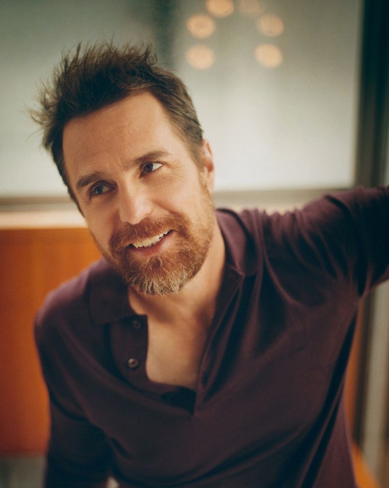 Actor Sam Rockwell wears a John Smedley merino wool polo shirt.