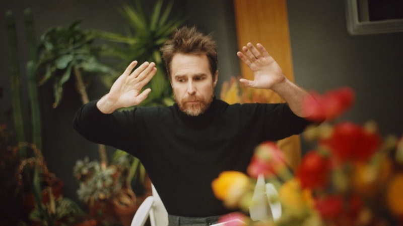 Sam Rockwell sports an Altea cashmere turtleneck sweater with Mr P. wide-leg trousers.