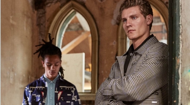 New Season Blues: Mikkel & Olajuwon Don Scotch & Soda Olajuwon Anderson and Mikkel Jensen wear new season styles from Scotch & Soda. Pictured left, Olajuwon sports a pair of the brand's statement striped cargo pants. Meanwhile, Mikkel dons a houndstooth jacket.