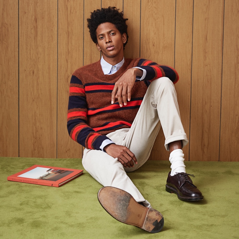 A preppy vision, Rafael Mieses models a Todd Snyder color block stripe alpaca sweater.