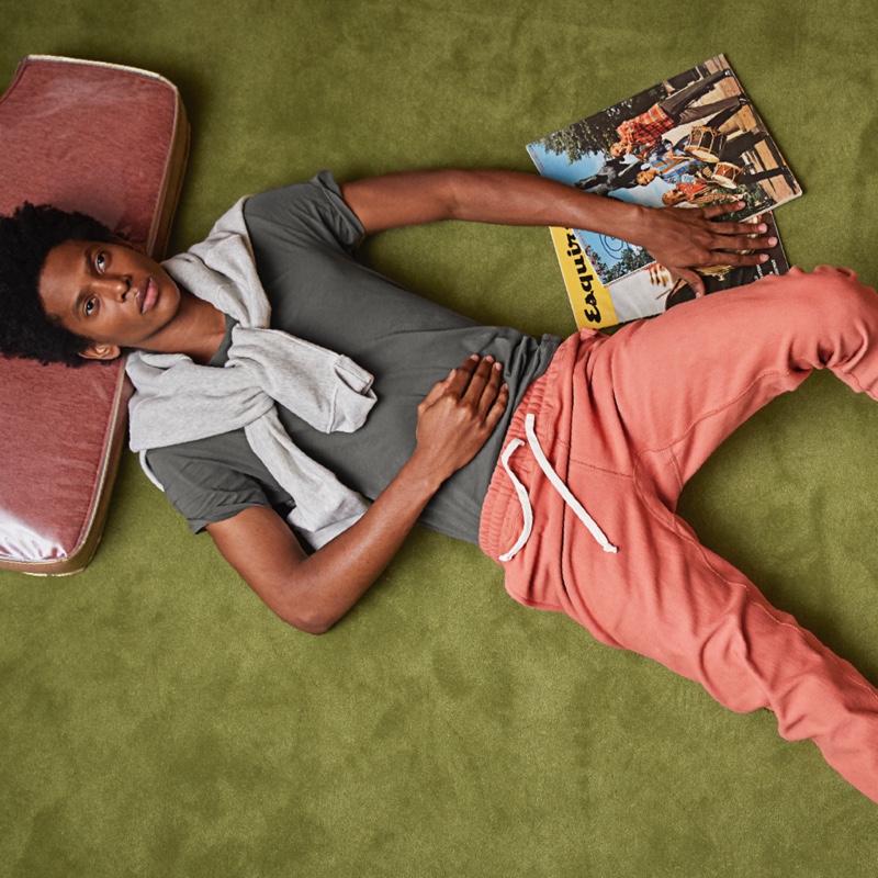 Embracing a retro style theme, Rafael Mieses wears Todd Snyder + Champion orange russet terry classic sweatpants.