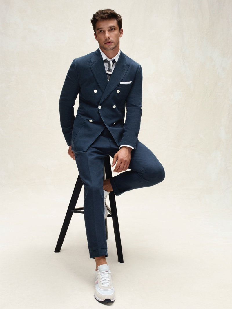 French model Alexis Petit sports a double-breasted suit from Tommy Hilfiger Tailored's spring-summer 2020 collection.