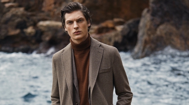 Valentin Caron dons a smart outfit with jeans, a coat, and more from Massimo Dutti.