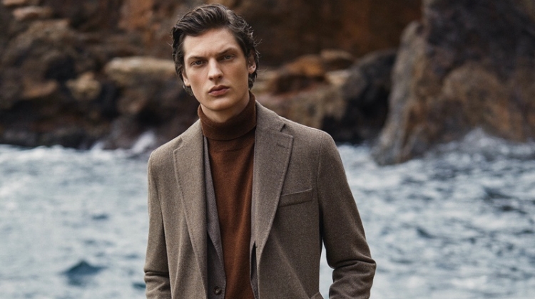 Valentin Caron dons a smart outfit with jeans, a coat, and more from Massimo Dutti.