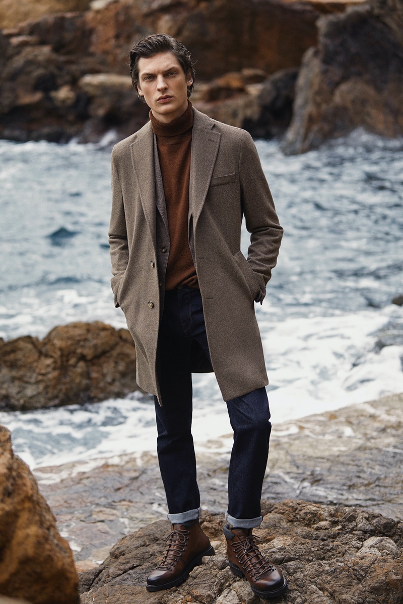 Valentin Caron dons a smart outfit with jeans, a coat, and more from Massimo Dutti.