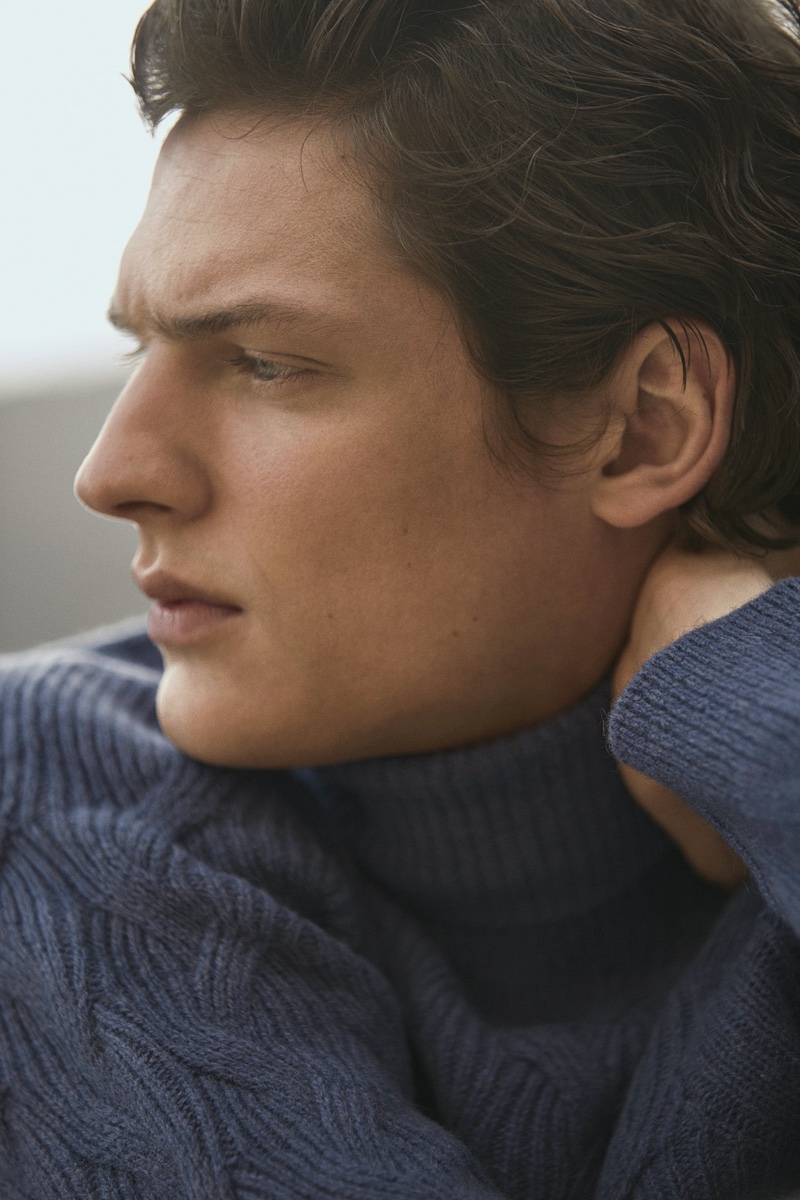 Model Valentin Caron sports a textured knit sweater by Massimo Dutti.