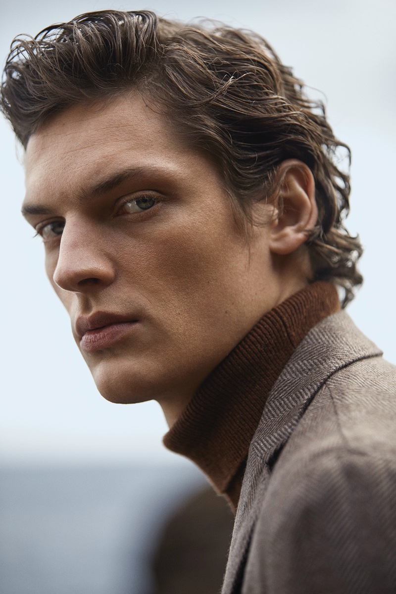 Ready for his close-up, Valentin Caron models a turtleneck sweater and suit jacket by Massimo Dutti.