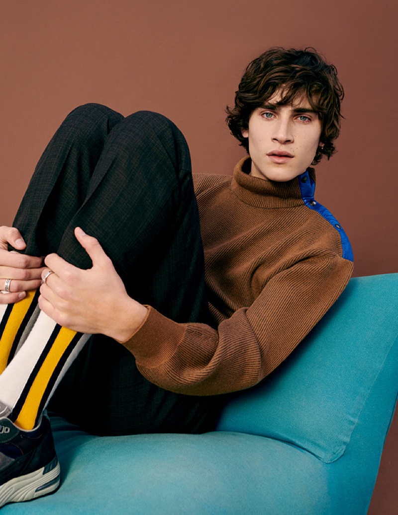 Front and center, Liam Kelly rocks a textured Lanvin sweater with checked trousers by YOOX.