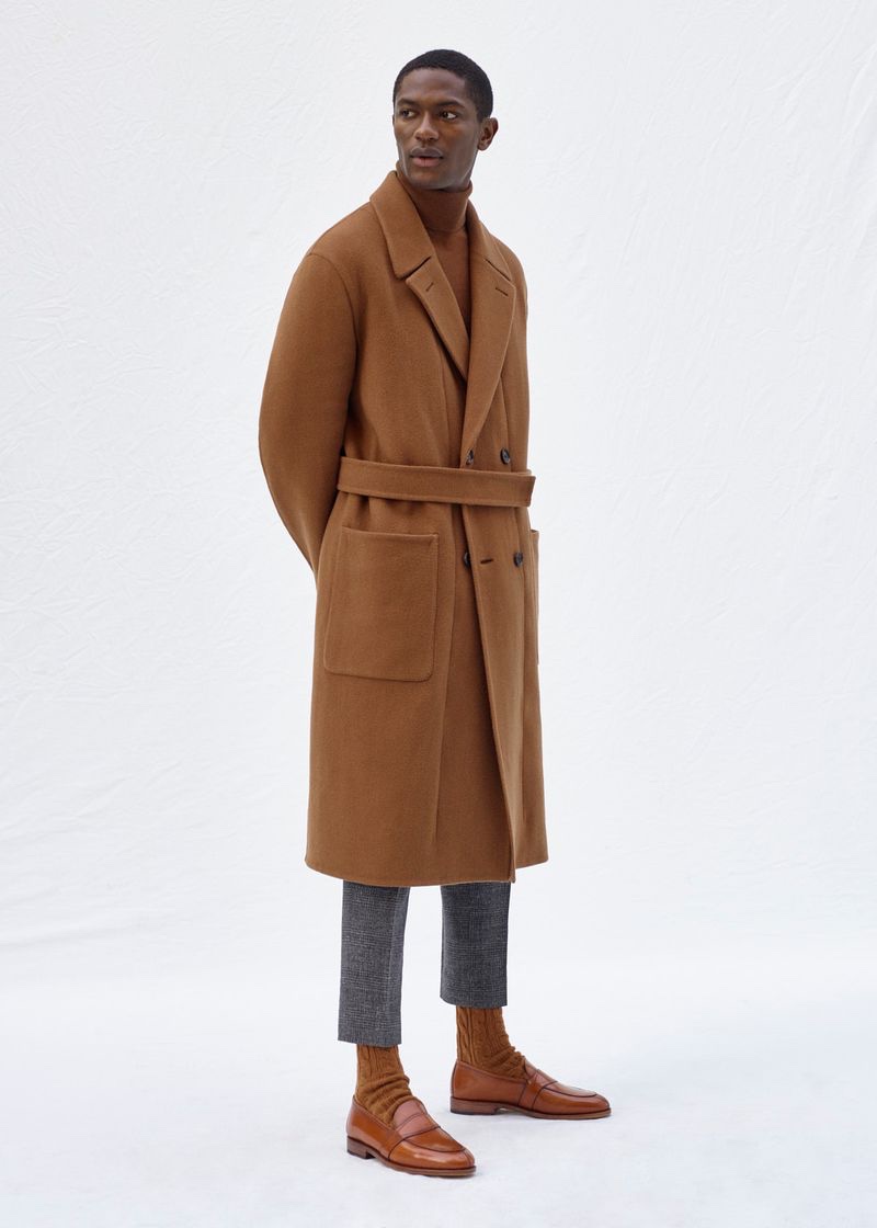 Hamid Onifade embraces monochromatic style in a brown coat and sweater from Agnona's fall-winter 2020 collection.