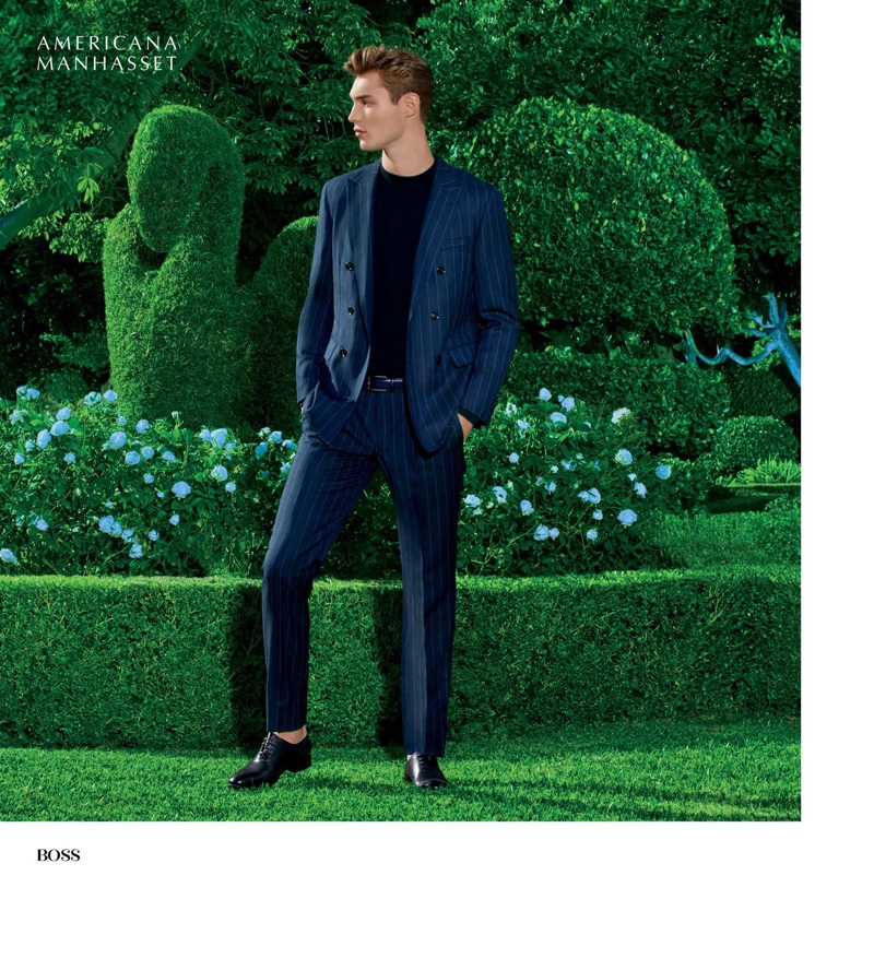 Donning a sharp pinstripe suit in navy, Kit Butler wears BOSS.