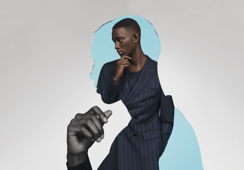 Oumar Diouf makes a sartorial impression in a pinstripe suit for BOSS' spring-summer 2020 campaign.