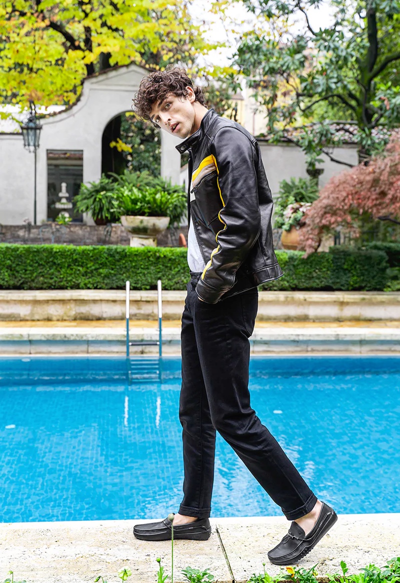 Pictured poolside, Alberto Perazzolo poses behind the scenes of Tod's spring-summer 2020 campaign.