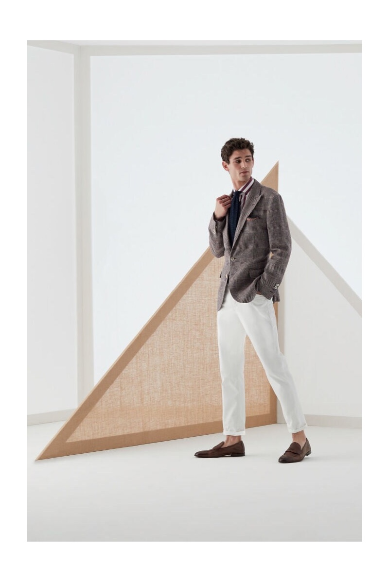 Embracing smart style, Arthur Gosse models a dashing look from Brunello Cucinelli.