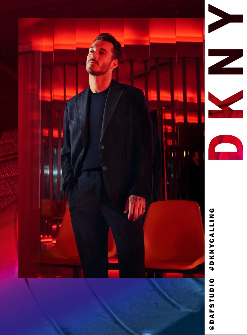 Donning a pinstripe suit, David Alexander Flinn fronts DKNY's spring-summer 2020 campaign.