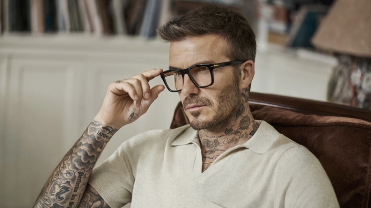 A smart vision, David Beckham dons black framed glasses from DB Eyewear.