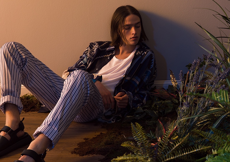 Relaxing, Maël wears a patterned shirt and pants from Hermès' spring-summer 2020 collection.