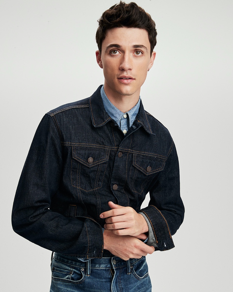 Jacob Bixenman sports a denim jean jacket, shirt, and jeans from Gap.