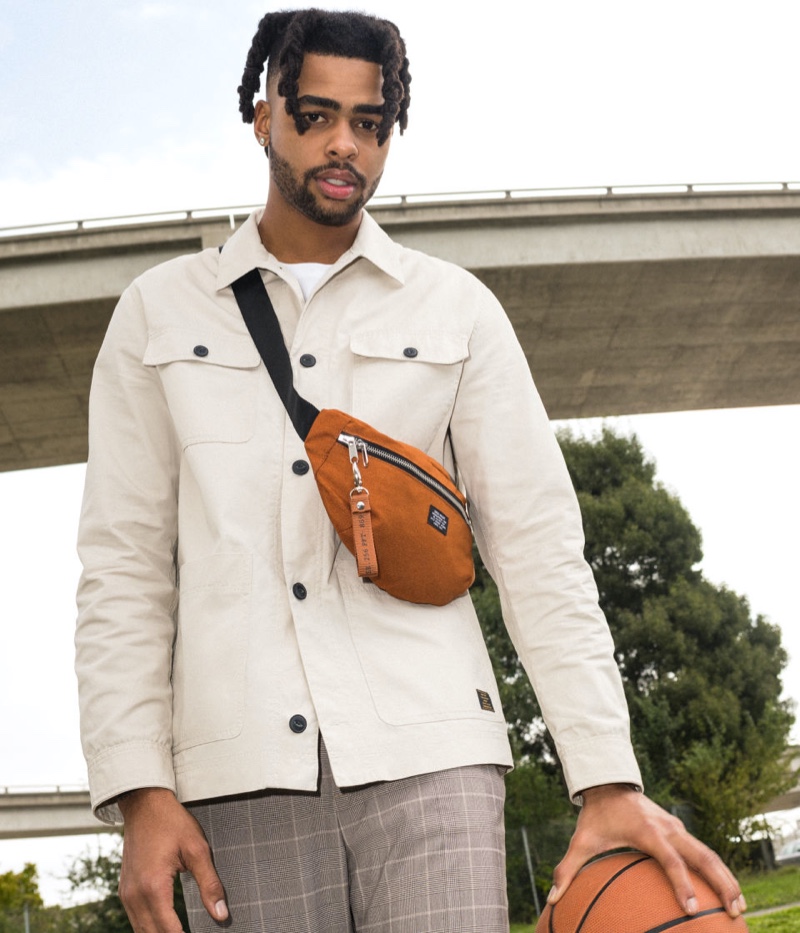 Connecting with H&M for spring, D'Angelo Russell wears a twill shirt jacket.