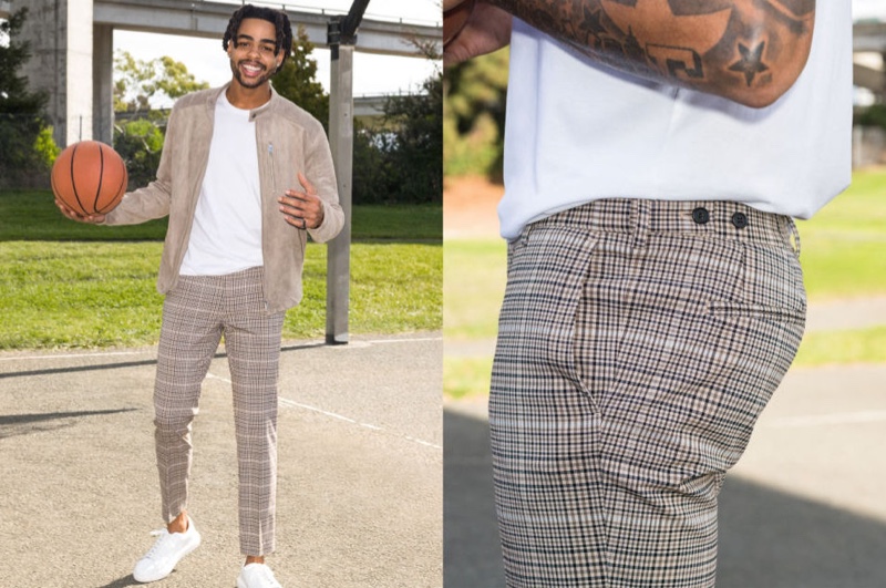 All smiles, D'Angelo Russell dons skinny fit suit pants with a racer jacket and tee from H&M.