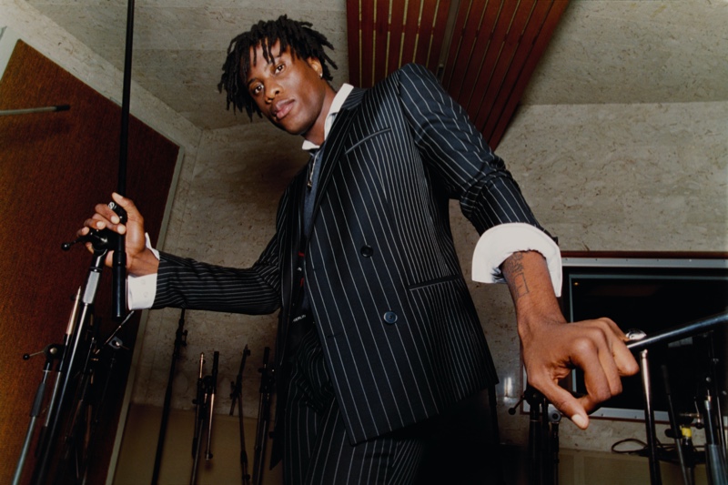 Obongjayar dons a pinstripe suit for HUGO's  spring-summer 2020 campaign.