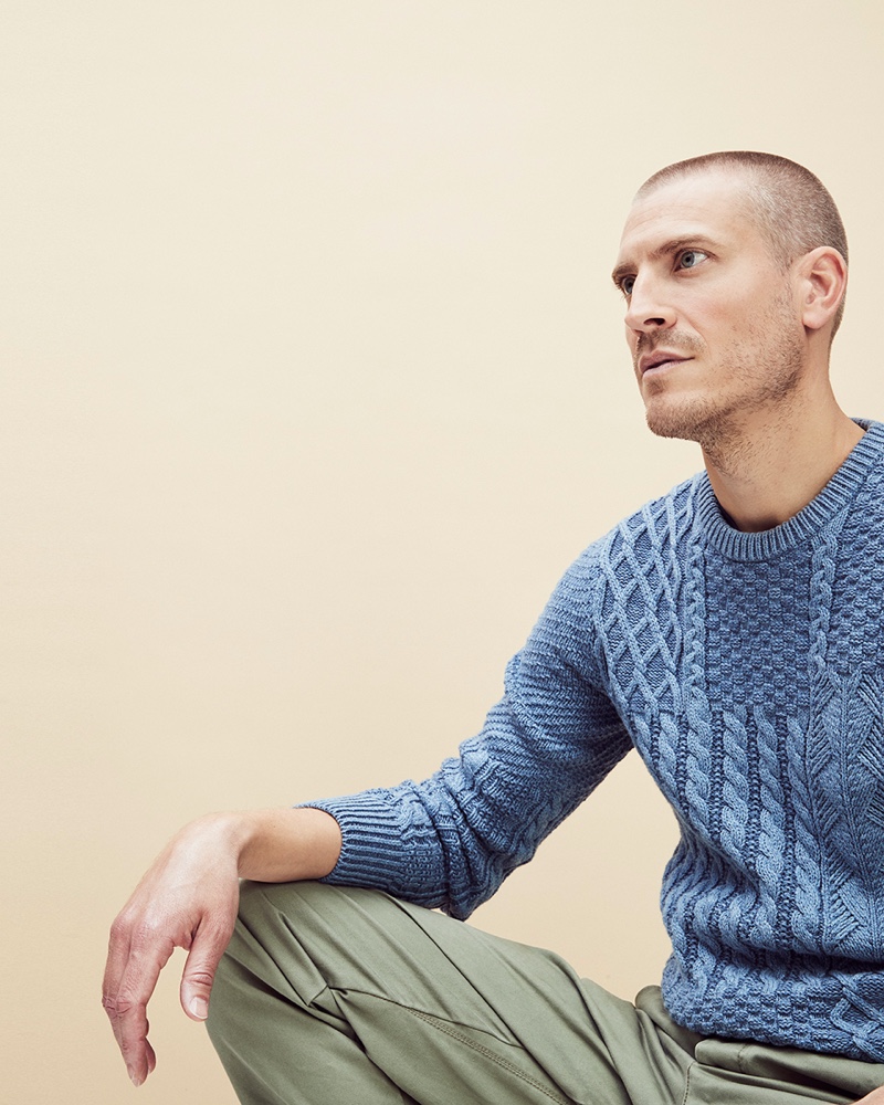 Mike Guenther models a blue cable-knit sweater by J.Crew.