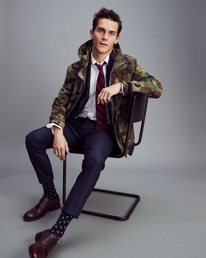 Vincent LaCrocq jazzes up a dapper J.Crew suit with a camouflage jacket.