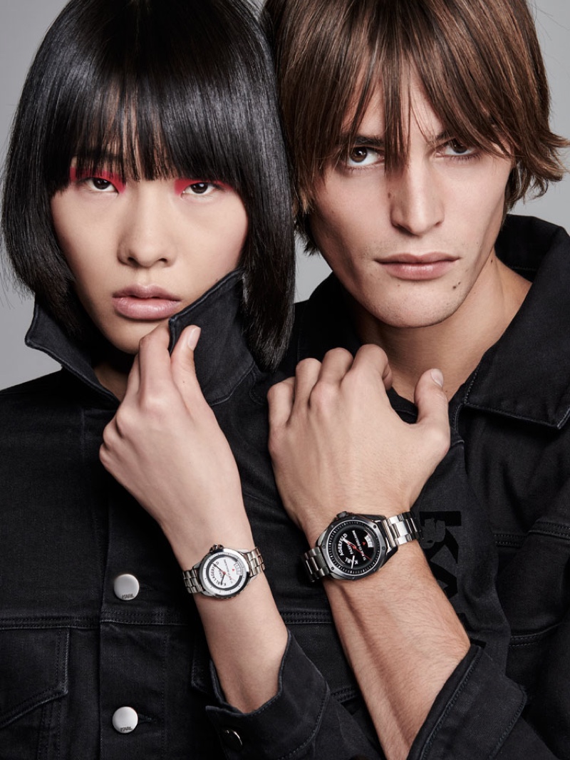 Models Ruinan Dong and Parker van Noord don spring-summer 2020 watches from Karl Lagerfeld.