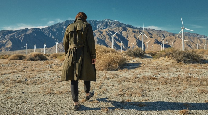 Taking to the desert, Jarrod Scott wears a Todd Snyder + Private White V.C. trench coat in olive with Todd Snyder drawstring stretch joggers.