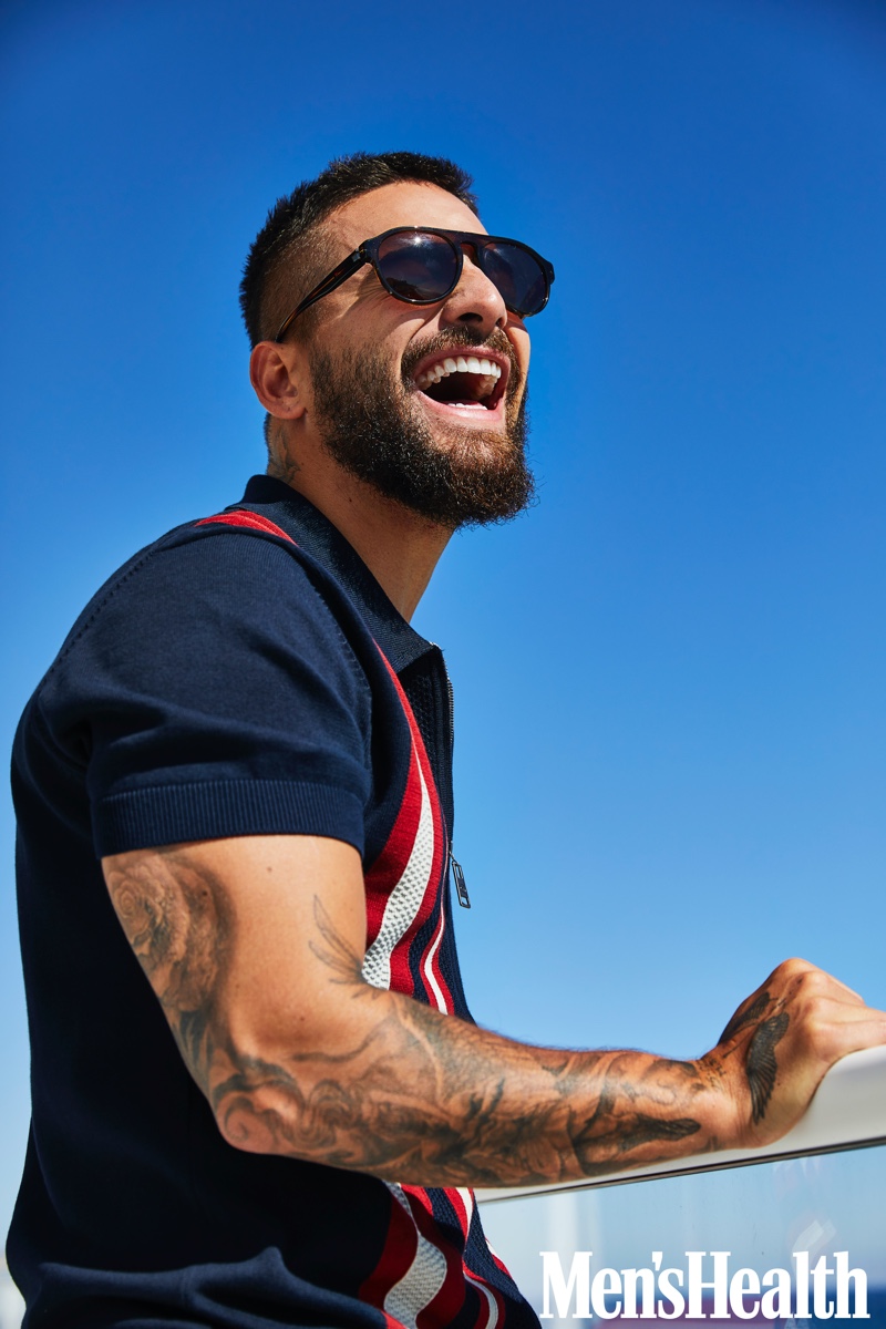 Connecting with Men's Health, Maluma wears a Ben Sherman knit polo with Starck Eyes sunglasses.