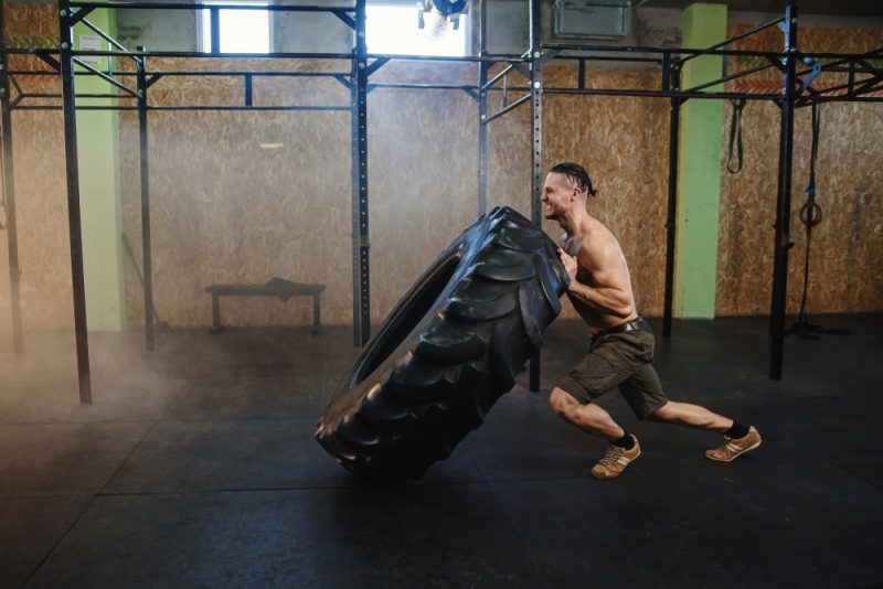 Man Exercising with Tire