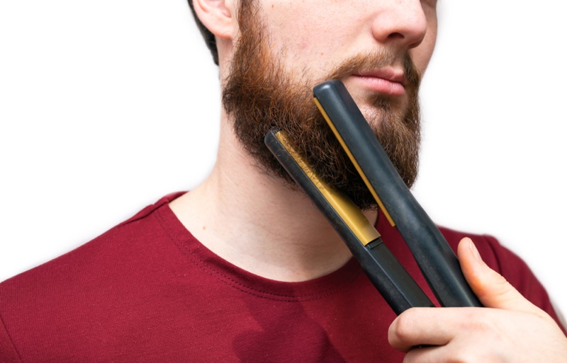 Man Straightening Beard Flat Iron