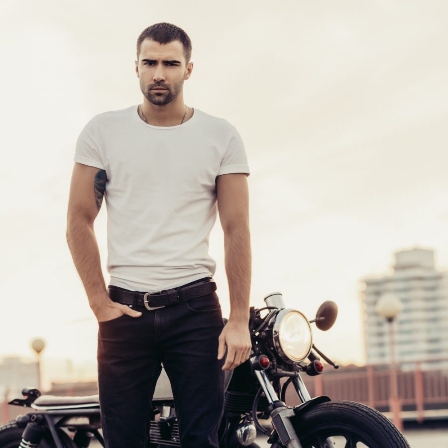 Man in Plain T-Shirt and Jeans by Motorcycle