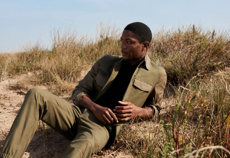 Embracing monochromatic style, Hamid Onifade dons a look from Mango.